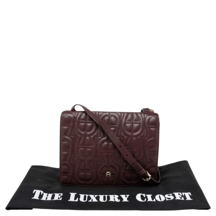 Pre Owned Aigner Burgundy Logo Embossed Leather Flap Crossbody Bag