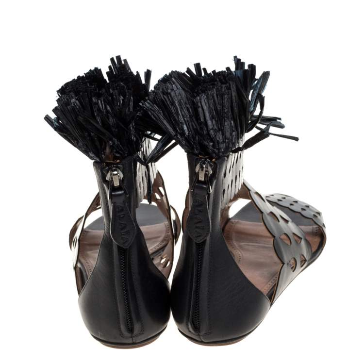 مملوكة مسبقًا Alaia Black Leather and Straw Cut Out Fringes Flat Sandals Size 39