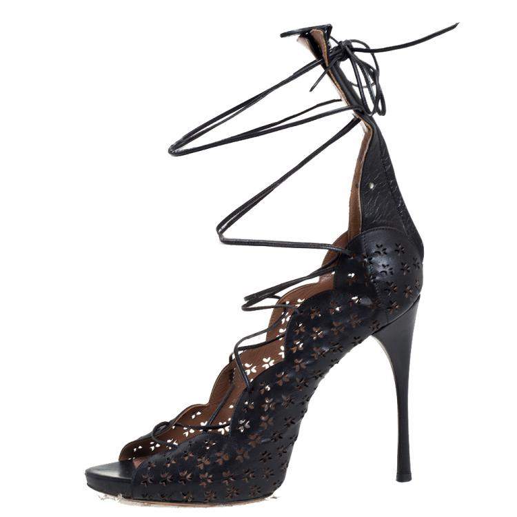مملوكة مسبقًا Alaia Black Laser Cut Leather Gladiator Ankle Wrap Sandals Size 37