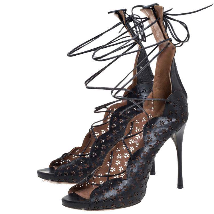 مملوكة مسبقًا Alaia Black Laser Cut Leather Gladiator Ankle Wrap Sandals Size 37