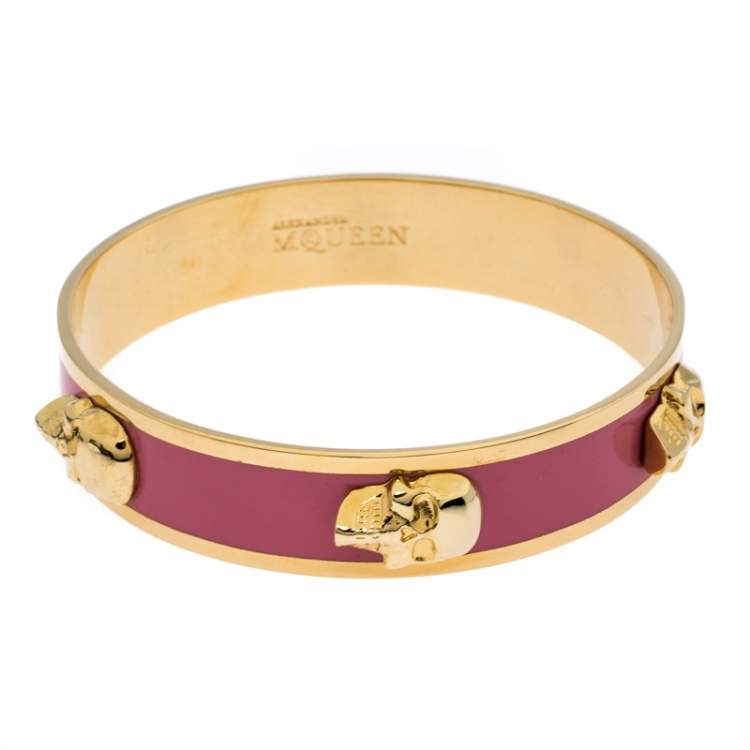 Gold tone with pink enamel womens bracelet