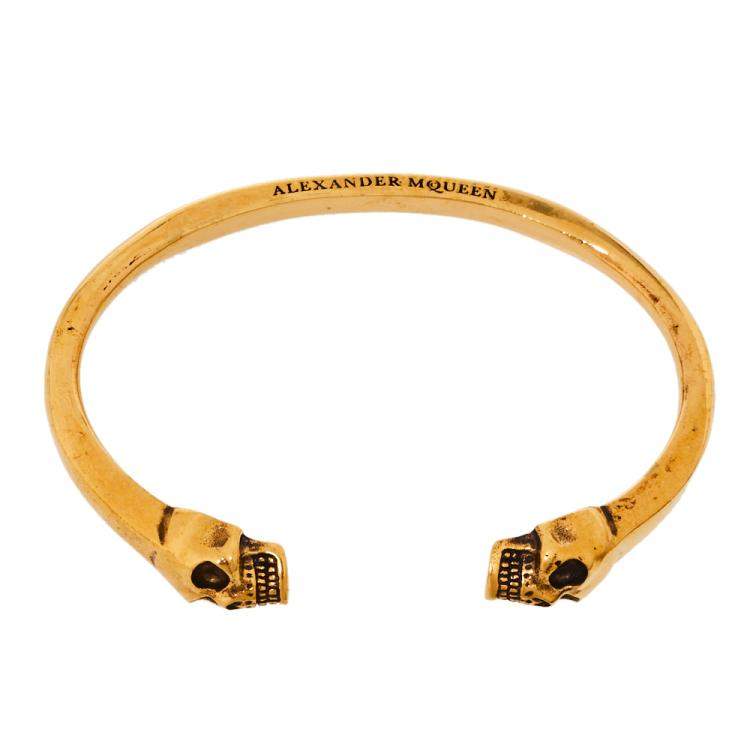 Pre Owned Alexander McQueen Twin Skull Motif Gold Tone Open Cuff Bracelet