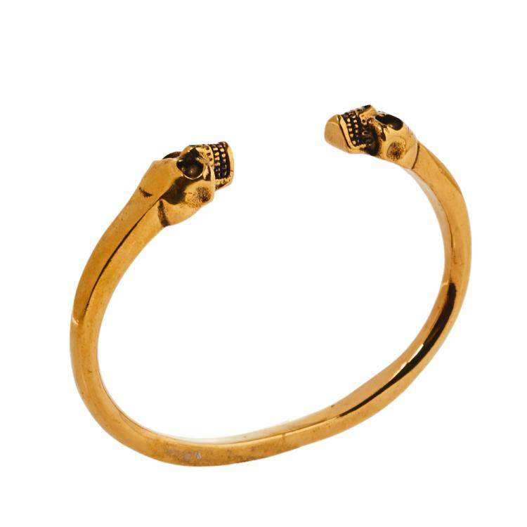Pre Owned Alexander McQueen Twin Skull Motif Gold Tone Open Cuff Bracelet
