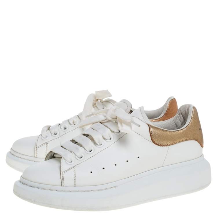 white and gold platform sneakers
