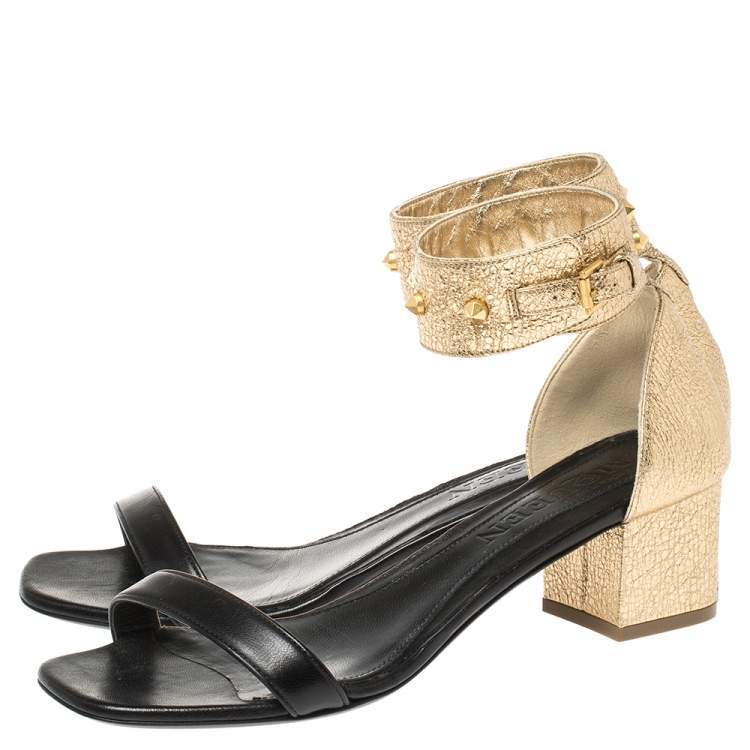 Pre Owned Alexander McQueen Gold/Black Leather Studded Ankle Wrap Sandals 39