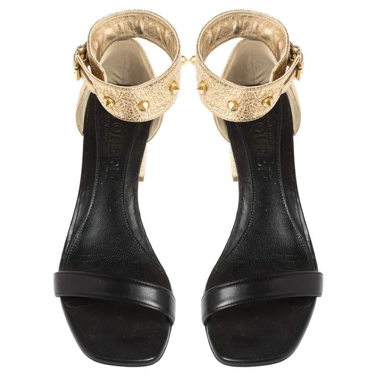 Pre Owned Alexander McQueen Gold/Black Leather Studded Ankle Wrap Sandals 39