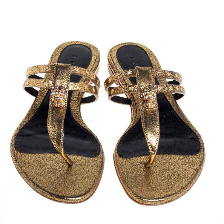 Pre Owned Alexander McQueen Metallic Gold Leather Embellished Skull Thong Flat Sandals Size 37.5