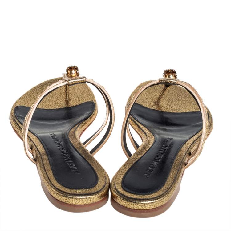 Pre Owned Alexander McQueen Metallic Gold Leather Embellished Skull Thong Flat Sandals Size 37.5