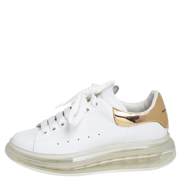 Alexander McQueen Low-top metallic-leather platform trainers | Metallic  gold shoes, Metallic sneakers, Black leather shoes