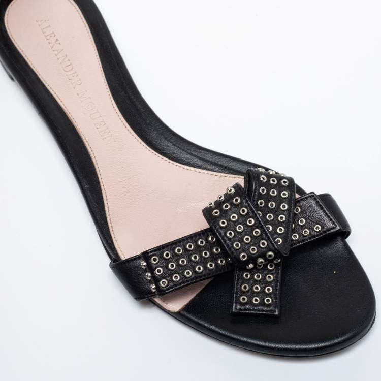 Pre Owned Alexander McQueen Black Leather Eyelet Embellished Bow Flat Ankle Strap Sandals Size 40