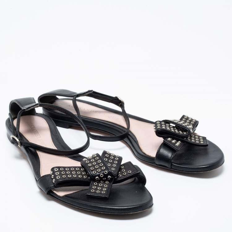Pre Owned Alexander McQueen Black Leather Eyelet Embellished Bow Flat Ankle Strap Sandals Size 40