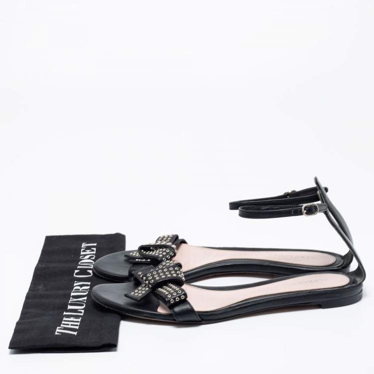 Pre Owned Alexander McQueen Black Leather Eyelet Embellished Bow Flat Ankle Strap Sandals Size 40