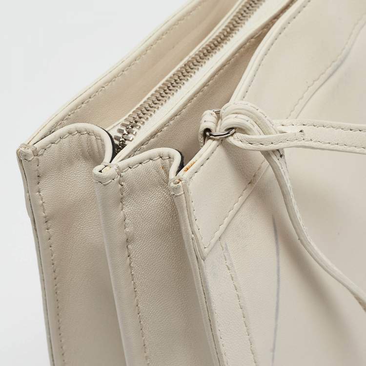 Pre Owned Balenciaga Off White Leather Perforated Logo Pochette Bag