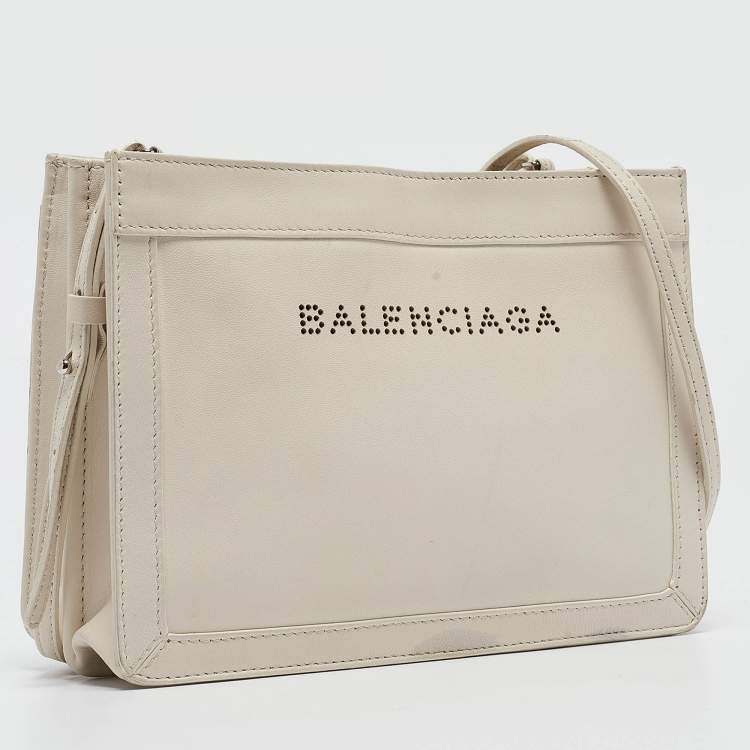 Pre Owned Balenciaga Off White Leather Perforated Logo Pochette Bag