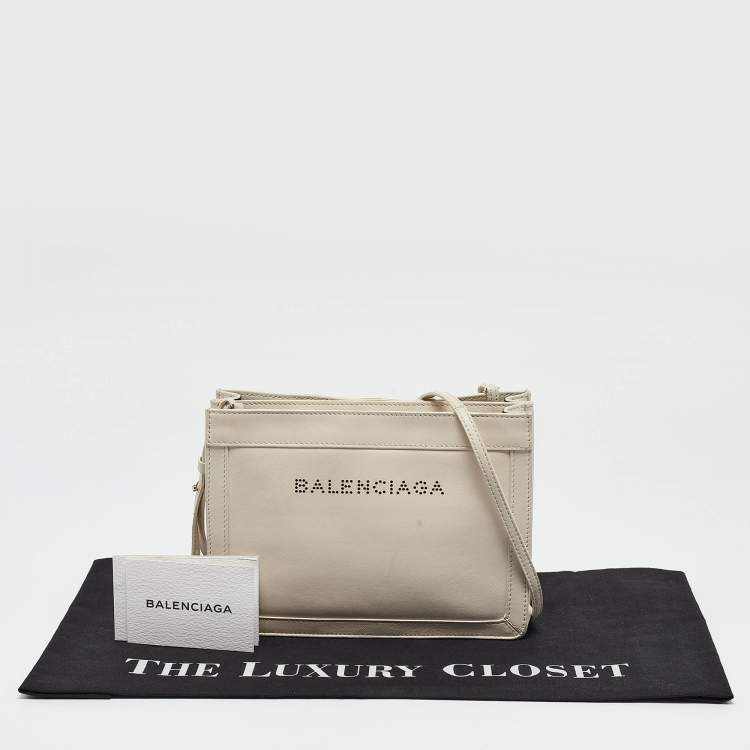 Pre Owned Balenciaga Off White Leather Perforated Logo Pochette Bag