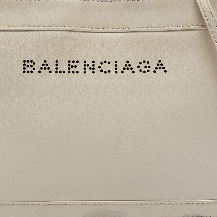 Pre Owned Balenciaga Off White Leather Perforated Logo Pochette Bag