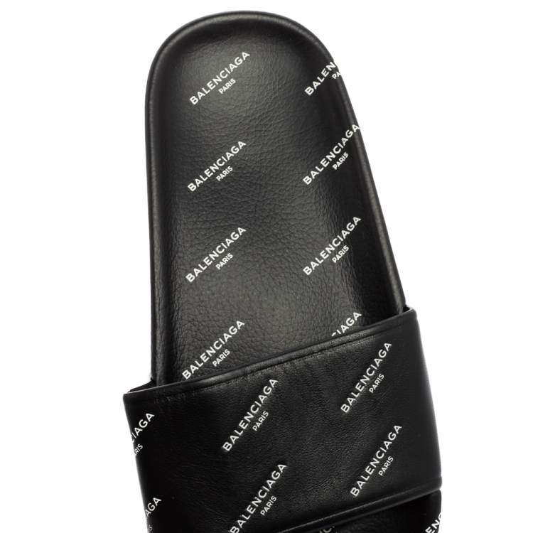Pre Owned Balenciaga Black All-Over Logo Stamped Leather Flat Slides Size 38