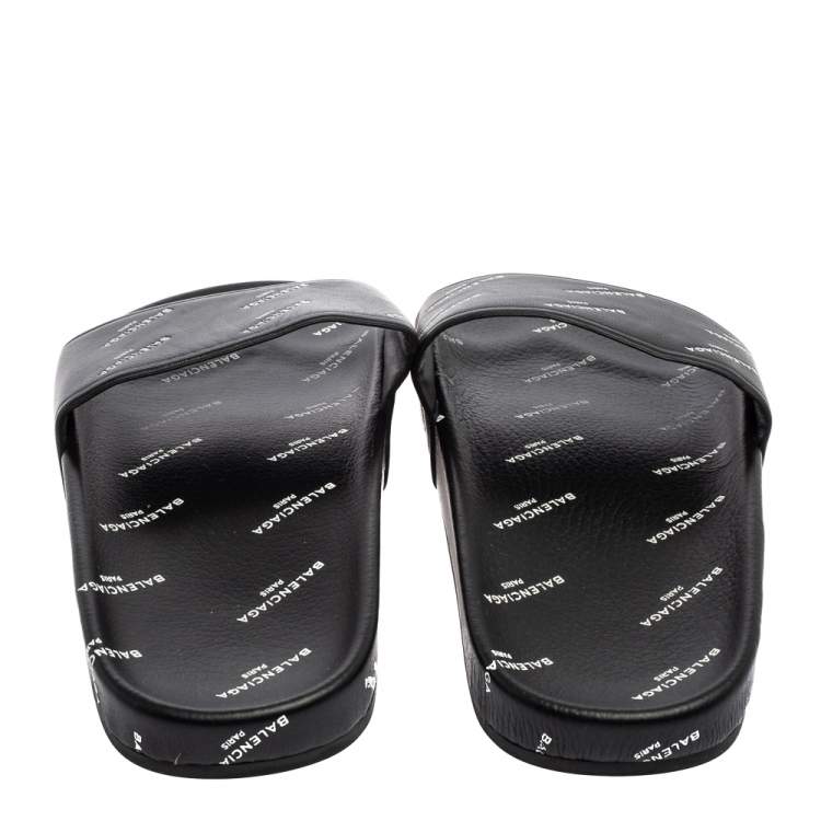Pre Owned Balenciaga Black All-Over Logo Stamped Leather Flat Slides Size 38