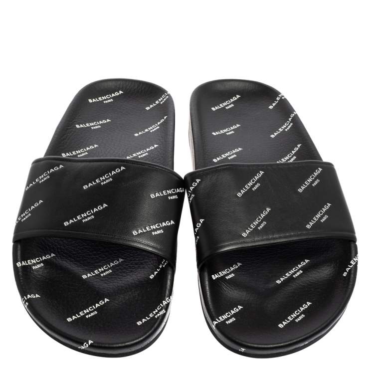 Pre Owned Balenciaga Black All-Over Logo Stamped Leather Flat Slides Size 38
