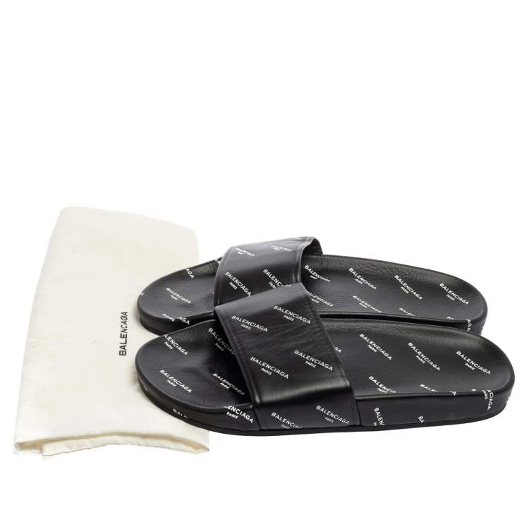 Pre Owned Balenciaga Black All-Over Logo Stamped Leather Flat Slides Size 38