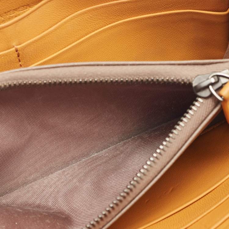 Pre Owned Bottega Veneta Saffron Yellow Intrecciato Leather Zip Continental Wallet