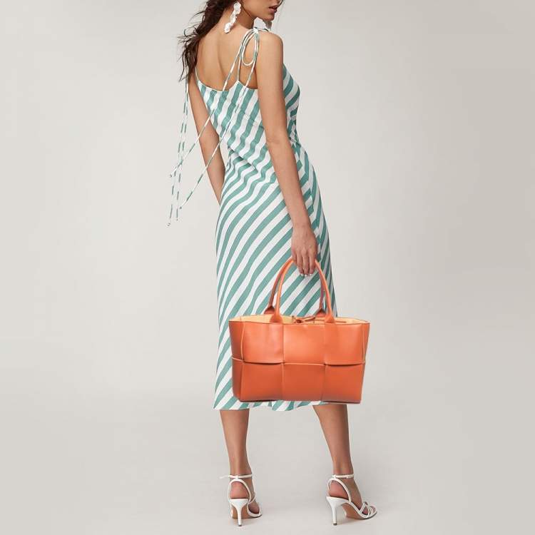 Pre Owned Bottega Veneta Orange Intrecciato Leather Arco Tote