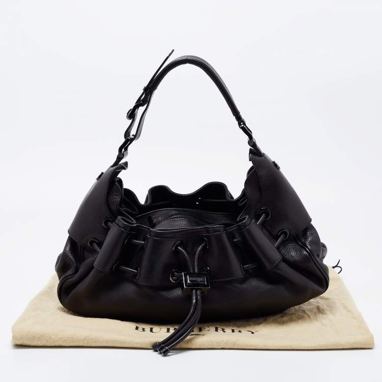 Pre Owned Burberry Black Leather Warrior Drawstring Hobo
