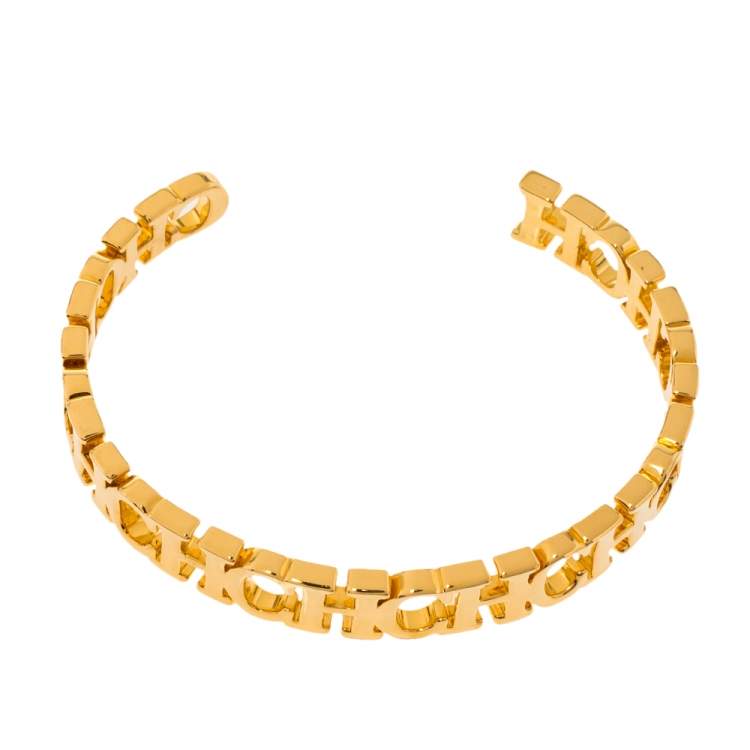 Pre Owned Carolina Herrera Gold Tone Between the Line Open Cuff Bracelet