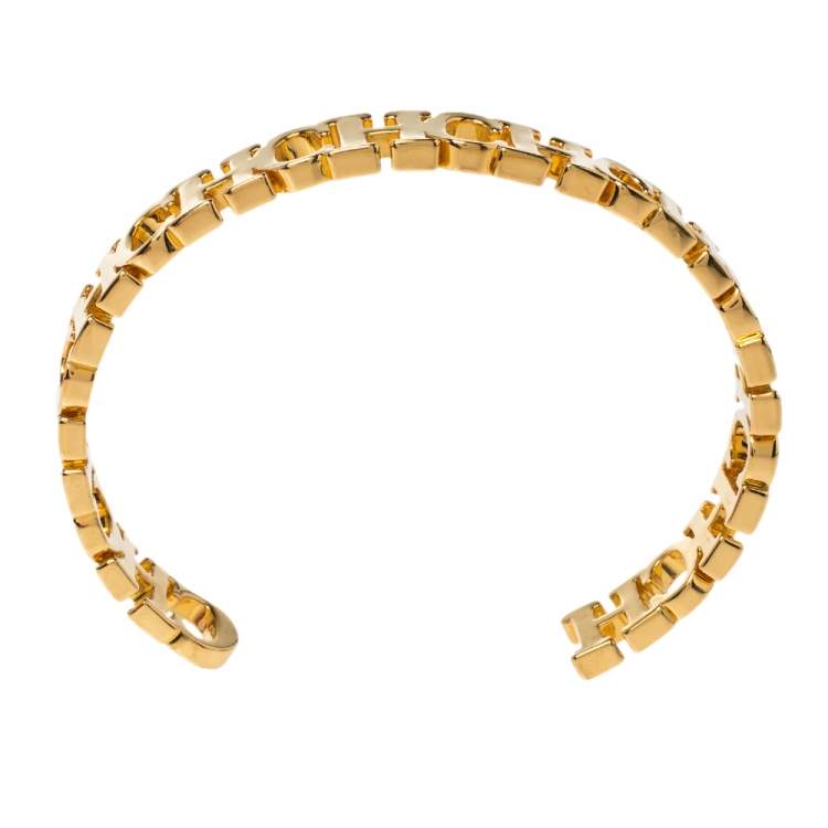 Pre Owned Carolina Herrera Gold Tone Between the Line Open Cuff Bracelet