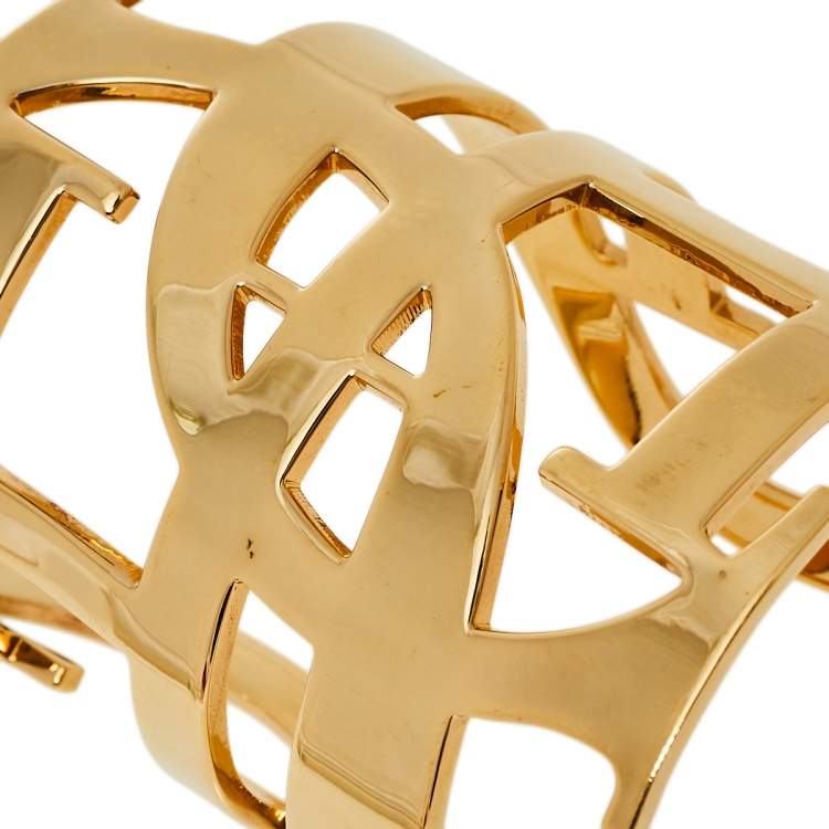 Pre Owned Carolina Herrera Gold Tone Logo Cuff Bracelet