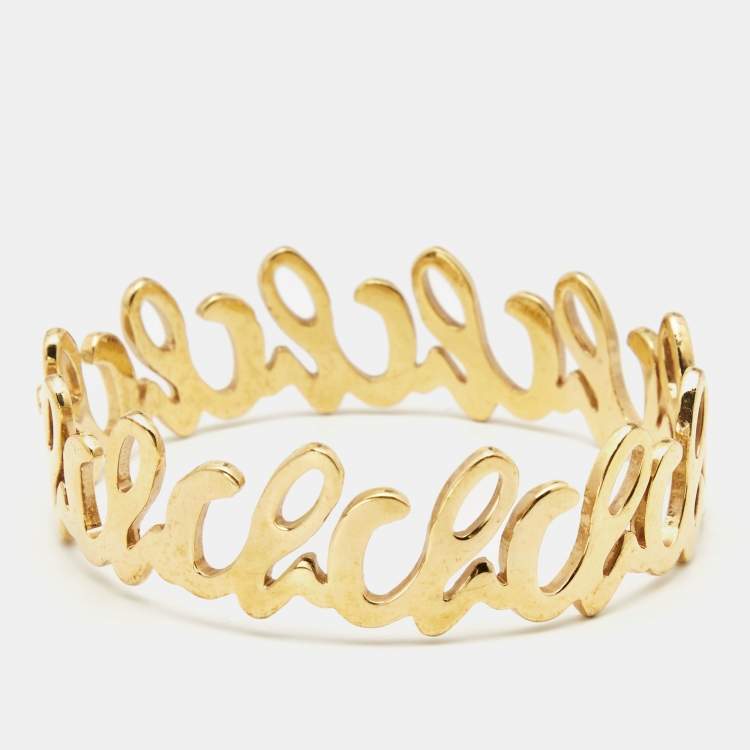 Pre Owned Carolina Herrera Gold Tone Logo Bangle Bracelet 