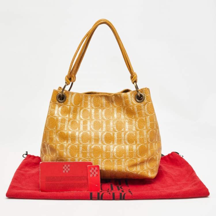 Pre Owned Carolina Herrera Gold/Mustard Monogram Embossed Leather Ring Handle Hobo