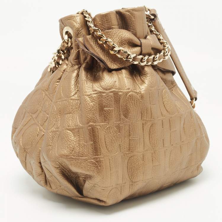 Pre Owned Carolina Herrera Gold Monogram Embossed Leather Bow Bucket Bag