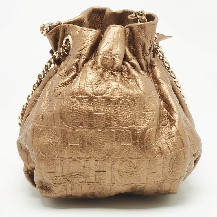 Pre Owned Carolina Herrera Gold Monogram Embossed Leather Bow Bucket Bag
