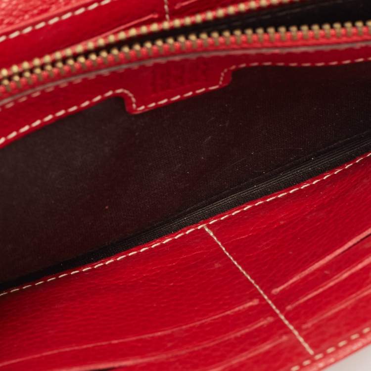 Pre Owned Carolina Herrera Red Monogram Embossed Leather Flap Continental Wallet