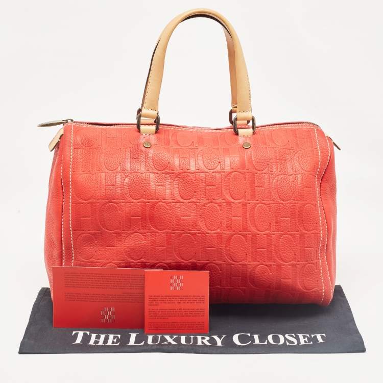 Pre Owned Carolina Herrera Red Monogram Embossed Leather Large Andy Boston Bag