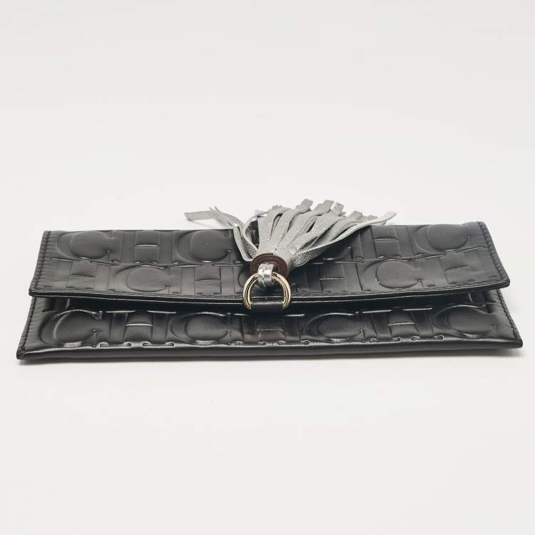Pre Owned Carolina Herrera Black Monogram Embossed Leather Tassel Clutch