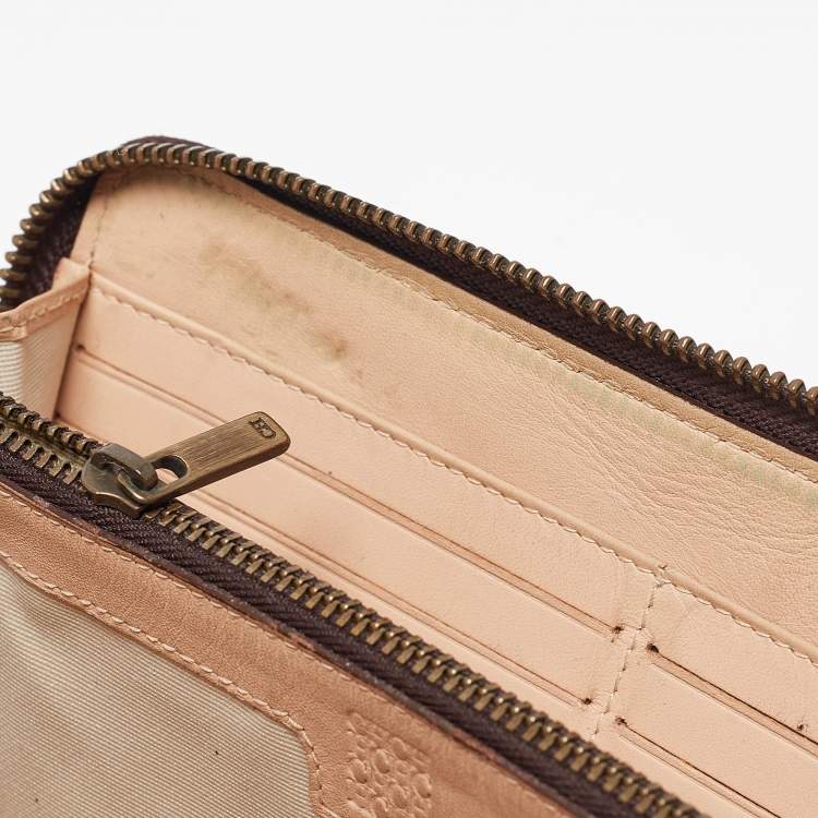Pre Owned Carolina Herrera Brown Monogram Embossed Leather Zip Continental Wallet