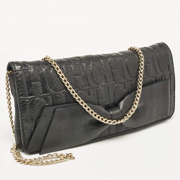 Pre Owned Carolina Herrera Black Monogram Embossed Leather Bow Flap Chain Clutch
