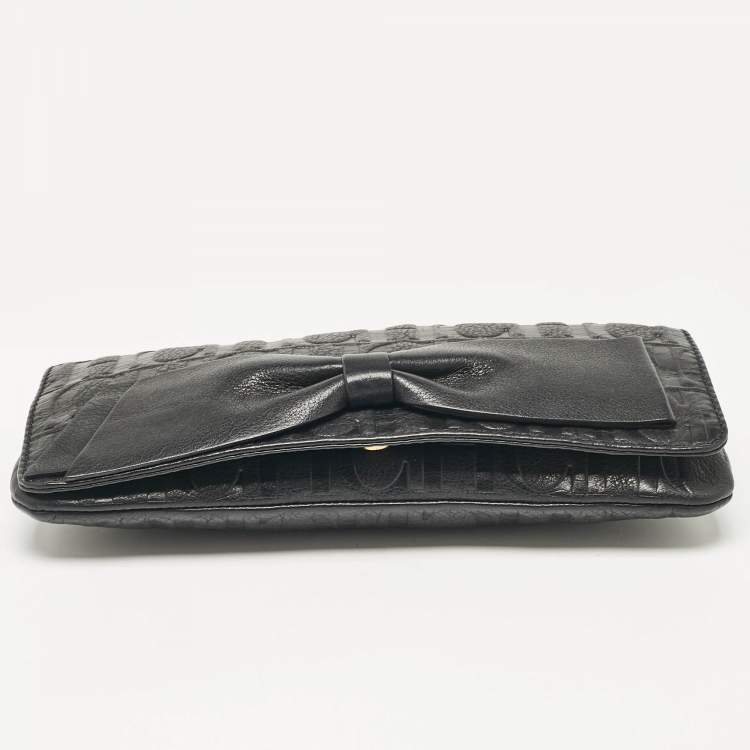 Pre Owned Carolina Herrera Black Monogram Embossed Leather Bow Flap Chain Clutch