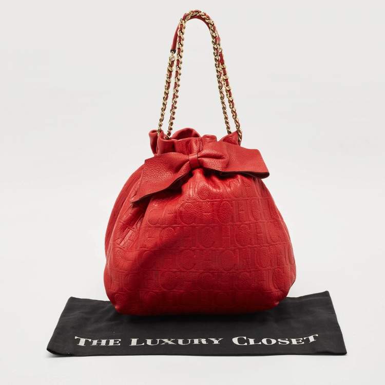 Pre Owned Carolina Herrera Red Monogram Embossed Leather Bow Bucket Shoulder Bag