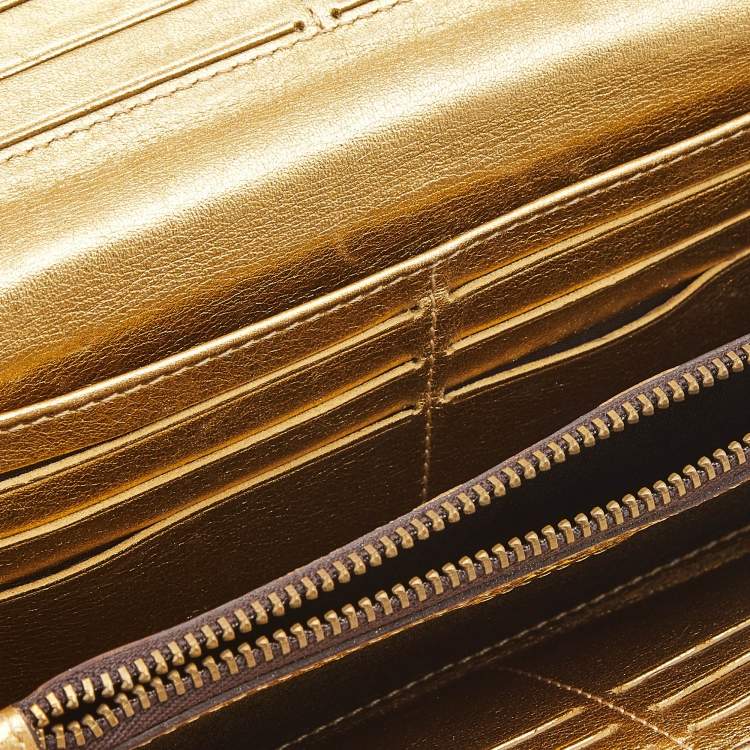 Pre Owned Carolina Herrera Gold Monogram Embossed Leather Tassel Flap Continental Wallet