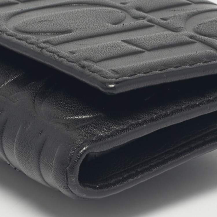 Pre Owned Carolina Herrera Black Monogram Embossed Leather Tassel Trifold Continental Wallet