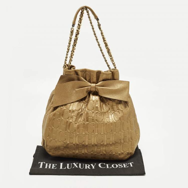 Pre Owned Carolina Herrera Bow Gold Monogram Embossed Leather Bucket Bag