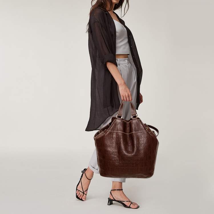 Pre Owned Carolina Herrera Dark Brown Monogram Embossed Leather Drawstring Oversized Tote