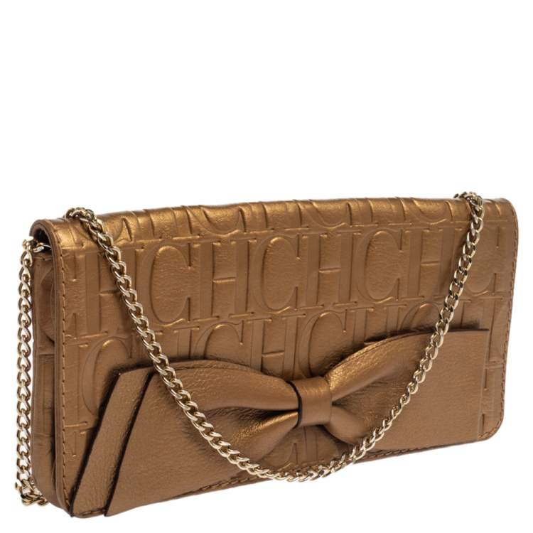 Pre Owned Carolina Herrera Gold Monogram Embossed Leather Bow Chain Clutch