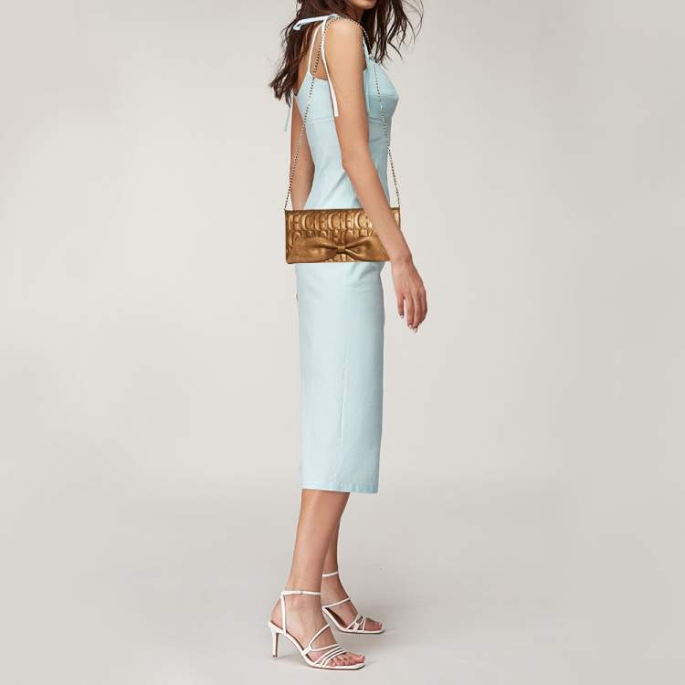 Pre Owned Carolina Herrera Gold Monogram Embossed Leather Bow Chain Clutch