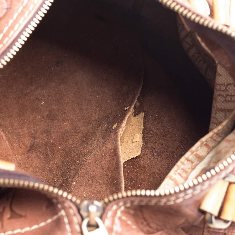 Pre Owned Carolina Herrera Brown Leather Monogram Embossed Andy Boston Bag