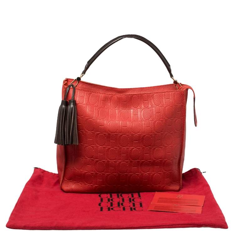 Pre Owned Carolina Herrera Red Monogram Embossed Leather Tassel Hobo