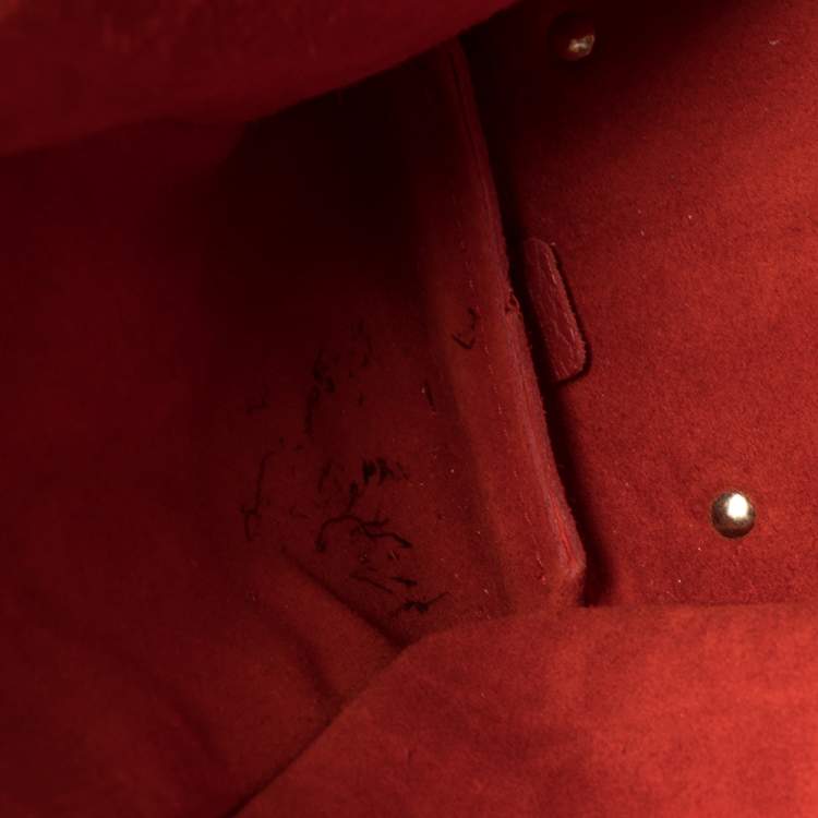 Pre Owned Carolina Herrera Red Monogram Embossed Leather Tassel Hobo